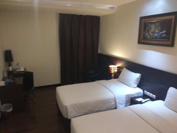 Imagen de la habitación del Hotel Continent Centrepoint Panakkukang. Foto 8