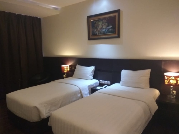 Imagen de la habitación del Hotel Continent Centrepoint Panakkukang. Foto 10