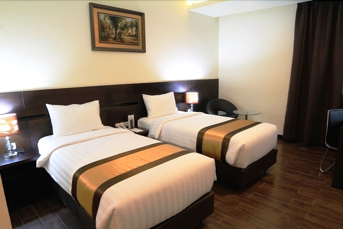 Imagen de la habitación del Hotel Continent Centrepoint Panakkukang. Foto 11