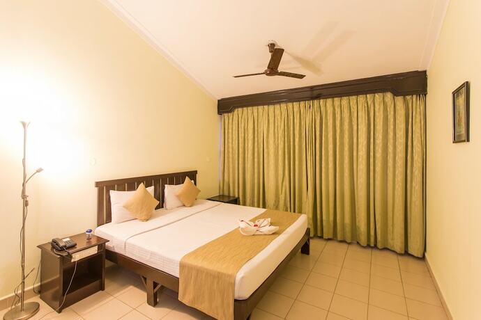 Imagen de la habitación del Hotel Coorg International. Foto 19