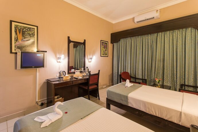 Imagen de la habitación del Hotel Coorg International. Foto 25