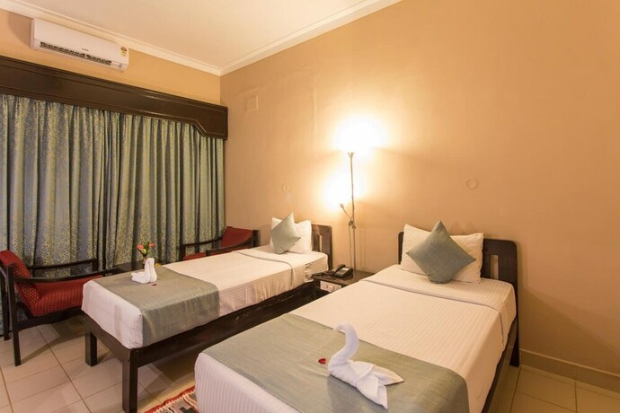 Imagen de la habitación del Hotel Coorg International. Foto 28