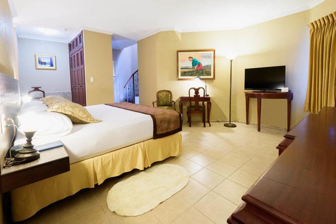 Imagen de la habitación del Hotel Copantl and Convention Center. Foto 7