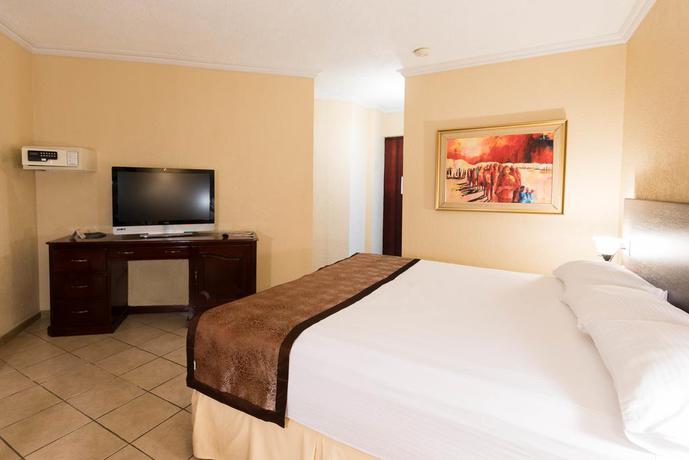 Imagen de la habitación del Hotel Copantl and Convention Center. Foto 9