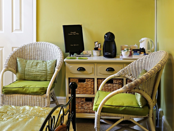 Imagen del bar/restaurante del Hotel Copperfields Vegetarian Guest House. Foto 6