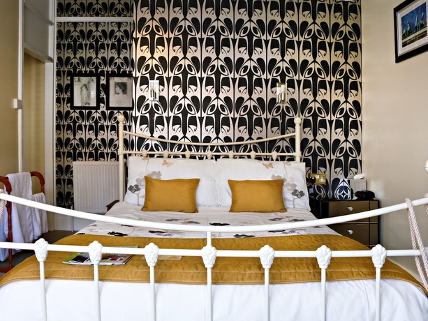 Imagen de la habitación del Hotel Copperfields Vegetarian Guest House. Foto 9