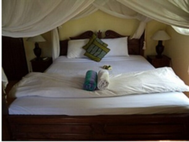 Imagen de la habitación del Hotel Coral Bay Bungalow. Foto 18