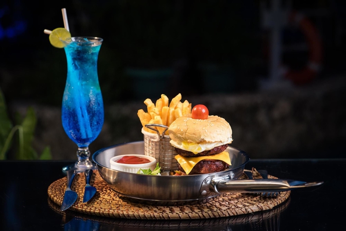 Imagen del bar/restaurante del Hotel Coral Beach Hotel Dar Es Salaam. Foto 3