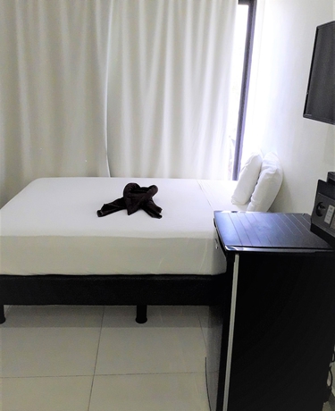 Imagen de la habitación del Hotel Coral Blue Beach Condo. Foto 7