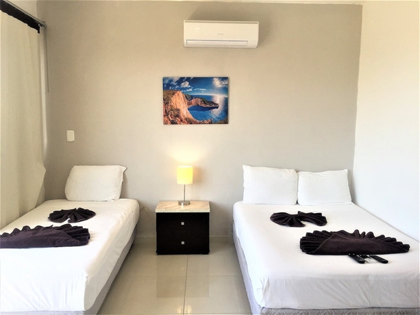 Imagen de la habitación del Hotel Coral Blue Beach Condo. Foto 11