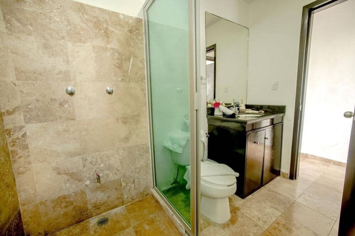 Imagen de la habitación del Hotel Coral Blue Beach Condo. Foto 16