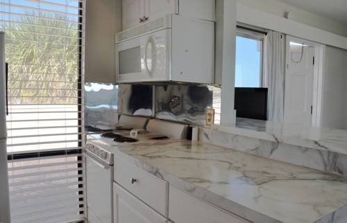 Imagen de la habitación del Hotel Coral Tides Resort & Beach Club. Foto 6