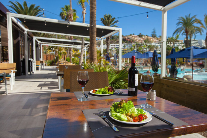 Imagen del bar/restaurante del Hotel Corallium Beach By Lopesan Hotels - Adults Only. Foto 5