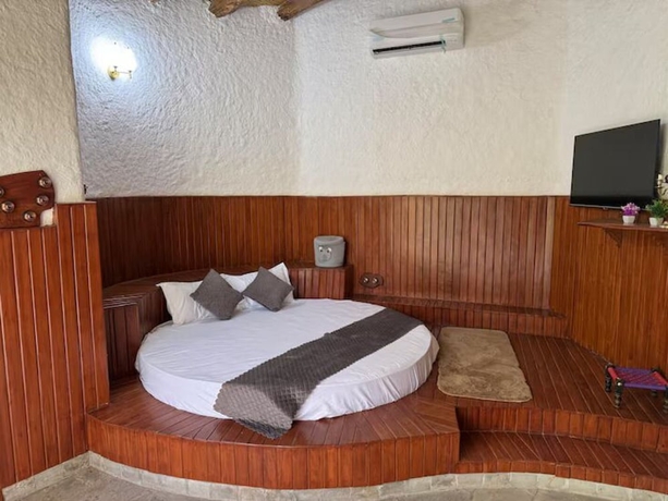 Imagen de la habitación del Hotel Corbett Cabana Farm. Foto 11