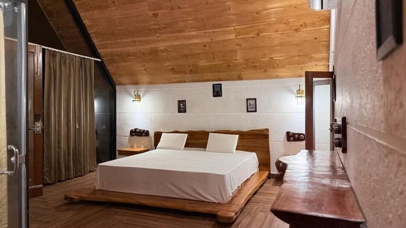 Imagen de la habitación del Hotel Corbett Cabana Farm. Foto 14