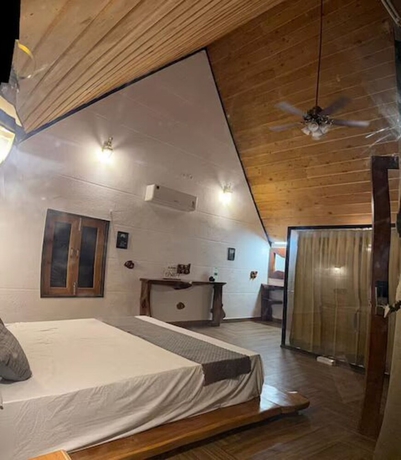 Imagen de la habitación del Hotel Corbett Cabana Farm. Foto 15