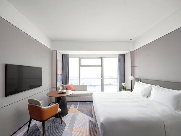 Imagen de la habitación del Hotel Cordis Shanghai Seaworld. Foto 3