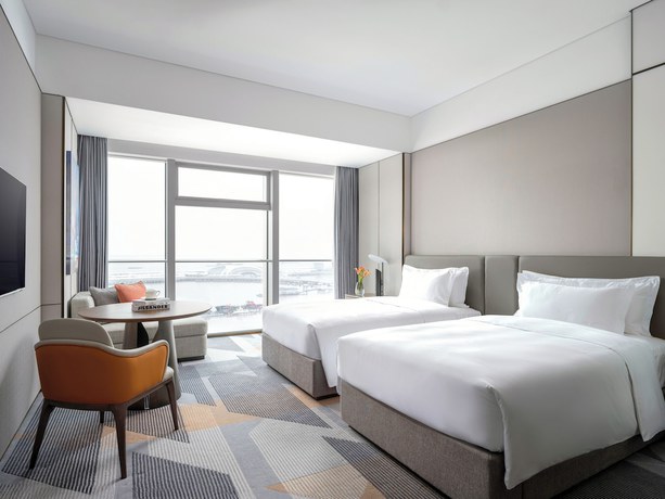 Imagen de la habitación del Hotel Cordis Shanghai Seaworld. Foto 4