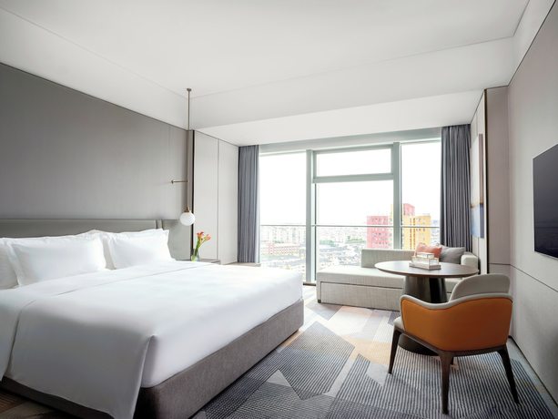 Imagen de la habitación del Hotel Cordis Shanghai Seaworld. Foto 8
