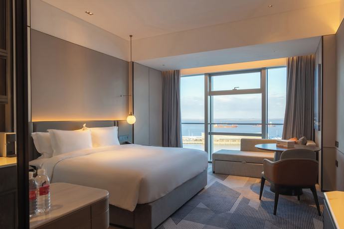 Imagen de la habitación del Hotel Cordis Shanghai Seaworld. Foto 14