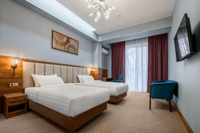 Imagen de la habitación del Hotel Corner Tashkent. Foto 19