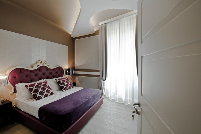 Imagen de la habitación del Hotel Corso Boutique Luxury Rooms. Foto 9