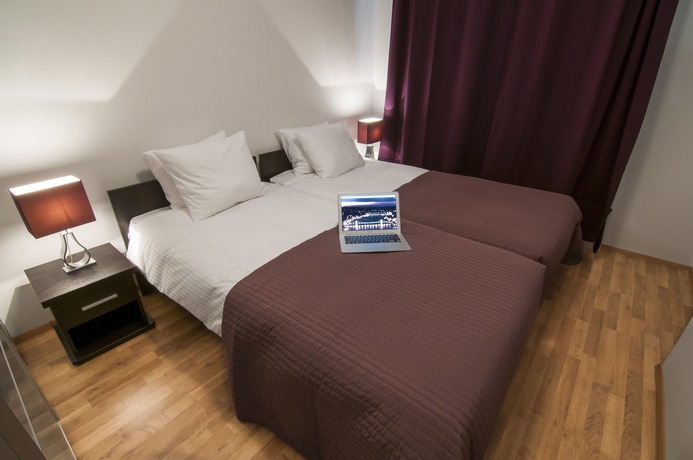 Imagen de la habitación del Hotel Corvin Center Suites. Foto 16