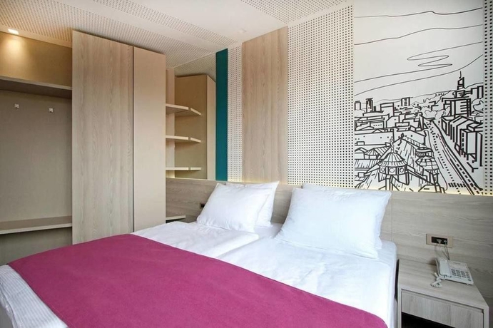 Imagen de la habitación del Hotel Cosmopolit. Foto 7