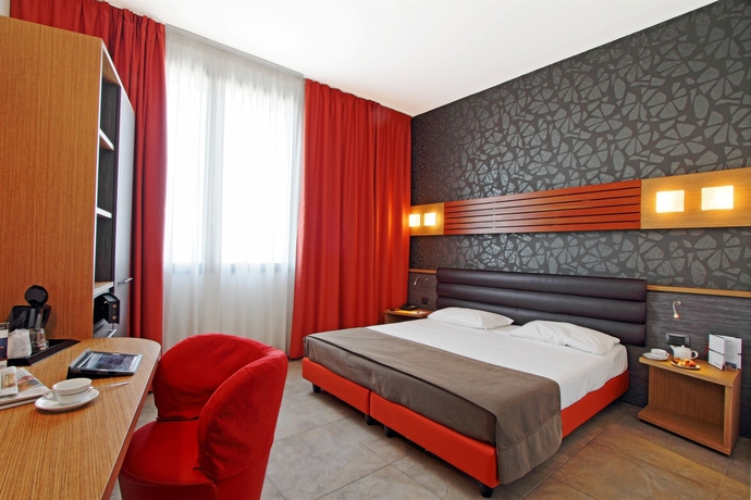 Imagen de la habitación del Hotel Cosmopolitan Bologna. Foto 10