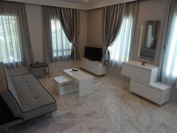 Imagen de la habitación del Hotel Cosmos Apartments. Foto 10