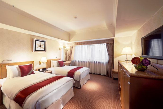 Imagen de la habitación del Hotel Cosmos Taipei. Foto 3