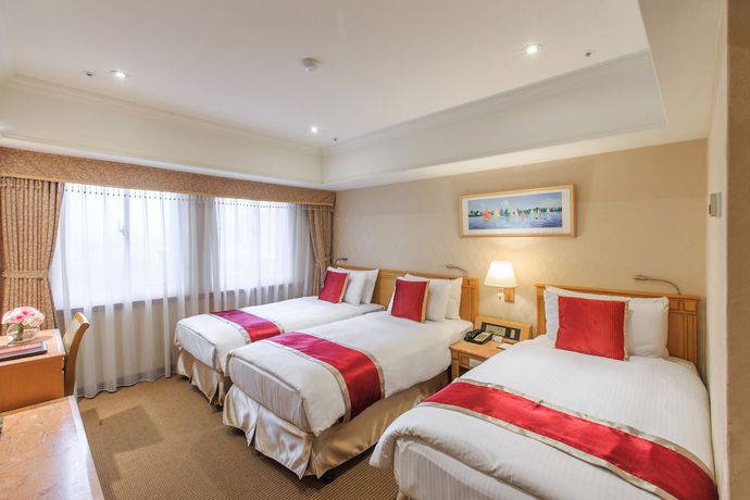 Imagen de la habitación del Hotel Cosmos Taipei. Foto 4