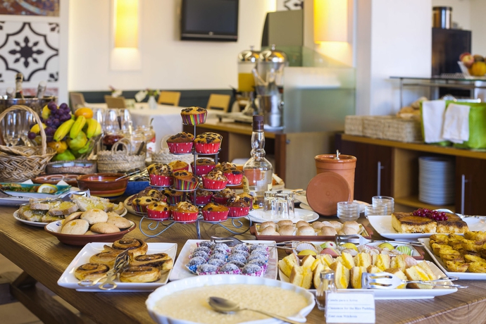 Imagen del bar/restaurante del Hotel Costa D’oiro Ambiance Village. Foto 2