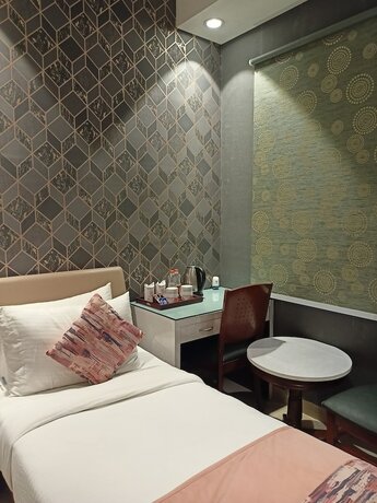 Imagen de la habitación del Hotel Cosy Grand. Foto 24