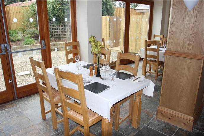 Imagen del bar/restaurante del Hotel Cottage Lea\'s Country and Restaurant. Foto 4