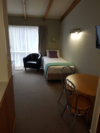 Imagen de la habitación del Hotel Cottage Mews Motel. Foto 17