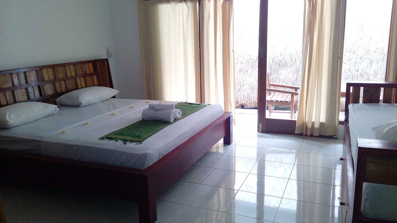 Imagen de la habitación del Hotel Cotton Tree Cottages. Foto 3