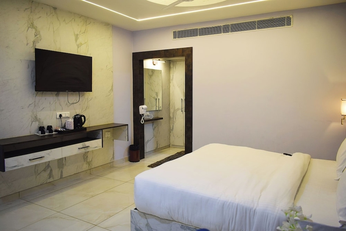 Imagen de la habitación del Hotel Country Ambience, Haldwani. Foto 8