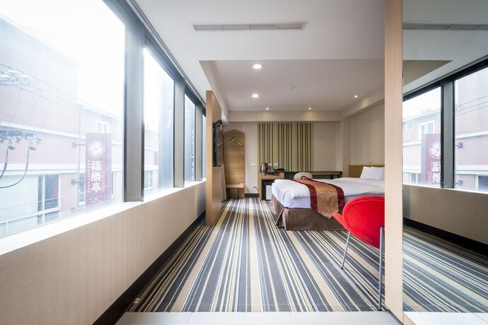 Imagen de la habitación del Hotel Country, Chiayi City. Foto 16