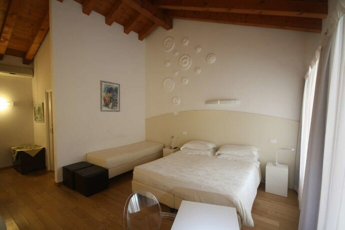 Imagen de la habitación del Hotel Country House Due Fiumi. Foto 16