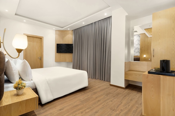 Imagen de la habitación del Hotel Country Inn Katra. Foto 9