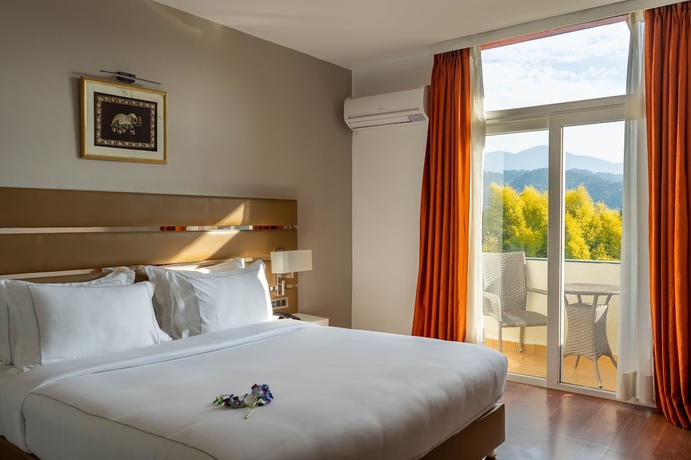 Imagen de la habitación del Hotel Country Inn Tarika Resort Jim Corbett. Foto 14