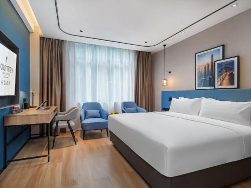 Imagen de la habitación del Hotel Country Inn & Suite by Radisson, Guangzhou Huadu Shiling. Foto 16