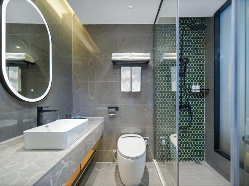 Imagen de la habitación del Hotel Country Inn & Suite by Radisson, Guangzhou Huadu Shiling. Foto 17