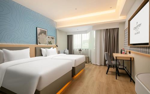 Imagen de la habitación del Hotel Country Inn & Suite by Radisson, Guangzhou Railway Station Xiaobei. Foto 14