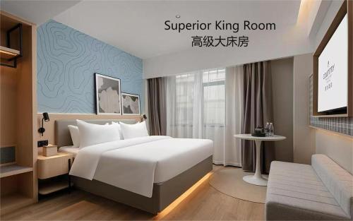 Imagen de la habitación del Hotel Country Inn & Suite by Radisson, Guangzhou Railway Station Xiaobei. Foto 16