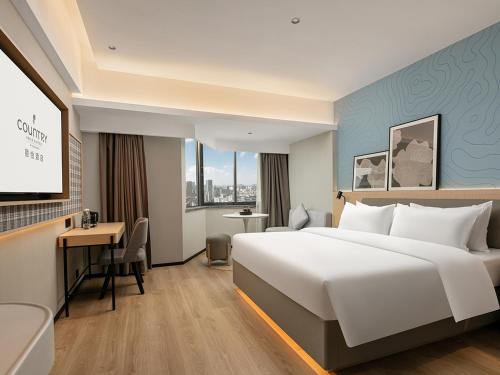 Imagen de la habitación del Hotel Country Inn & Suite by Radisson, Guangzhou Railway Station Xiaobei. Foto 17