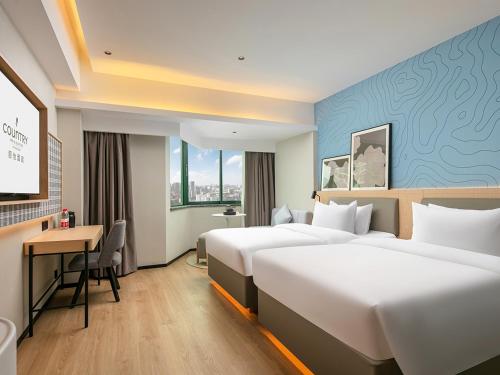 Imagen de la habitación del Hotel Country Inn & Suite by Radisson, Guangzhou Railway Station Xiaobei. Foto 18