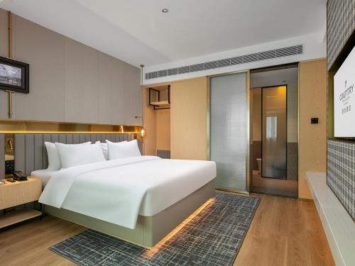 Imagen general del Hotel Country Inn & Suite by Radisson, Guangzhou Railway Station Xiaobei. Foto 13