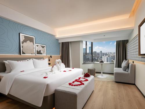 Imagen de la habitación del Hotel Country Inn & Suite by Radisson, Guangzhou Railway Station Xiaobei. Foto 20